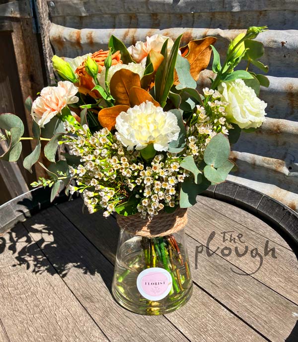 Flowers on a barrel at The Plough
